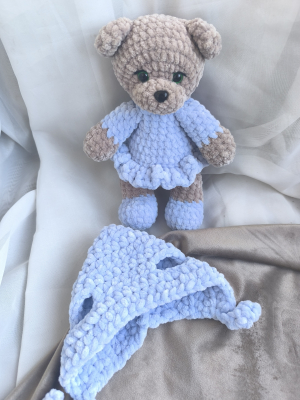 The little bear with a hat and a blue dress