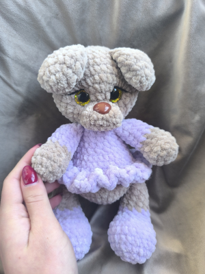 The little bear in a lilac dress